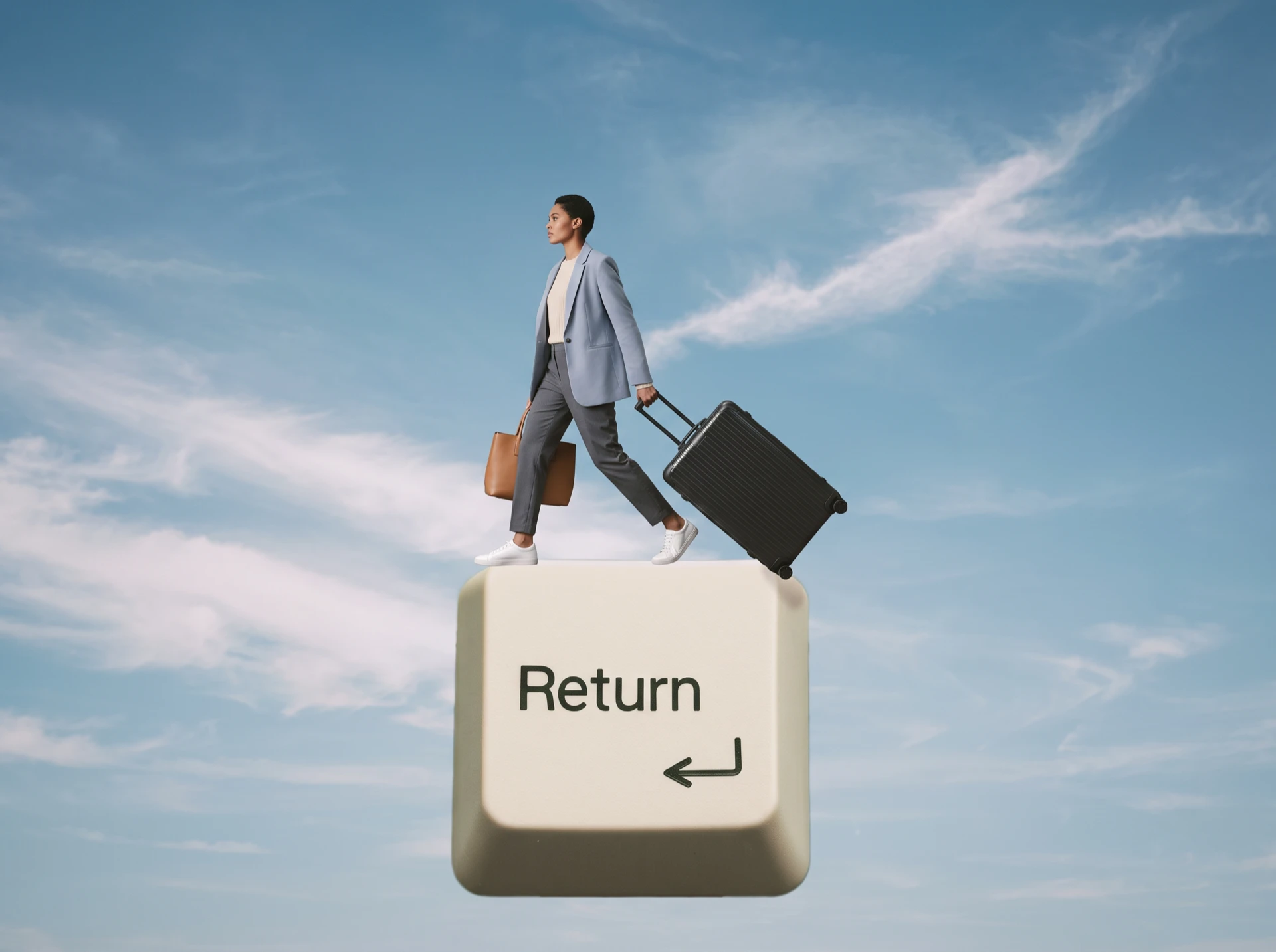 Woman in a blazer striding across a giant Return key, pulling a suitcase, mid-errand under a blue sky